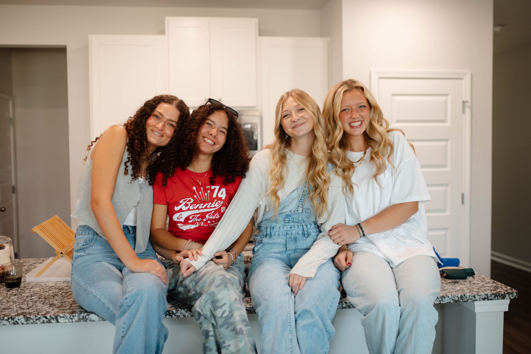 Students together in a host home kitchen